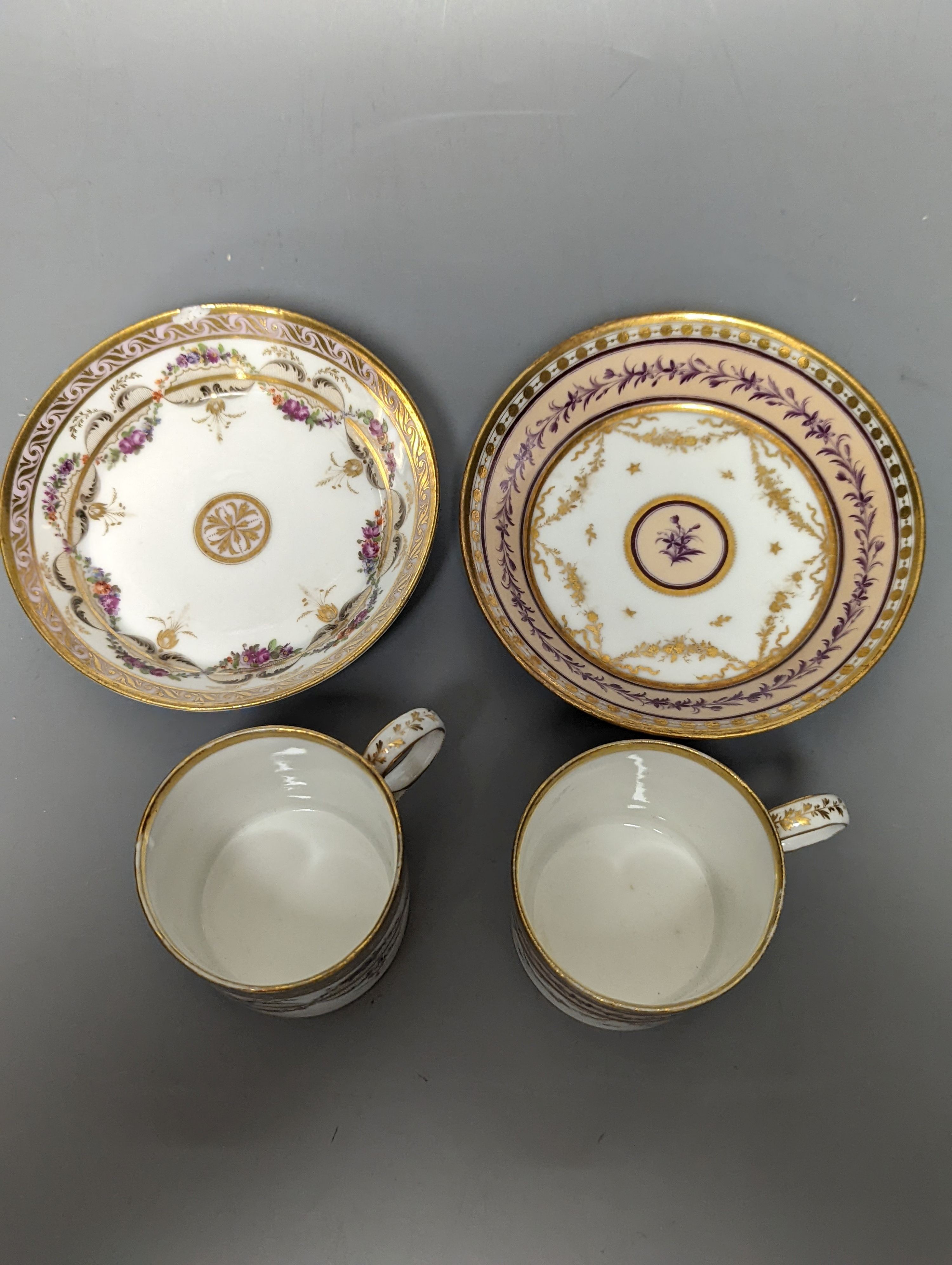 A Duc d'Angouleme coffee can and saucer painted with a puce chain of leaves on a salmon coloured ground and another painted with a flower chain, black feather and a gilt line, latter with stencilled red mark 'Manuf de M